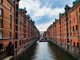 Naklejka premium View over a canal in the Speicherstadt of Hamburg, Germany.