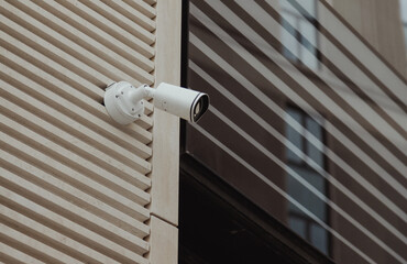 security camera on facade of corporate building