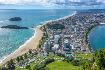 View from the summit of Mt Mauao volcano in Mount Maunganui, colloquially known as "The Mount". Panoramic view of the city and bay. Tauranga, Bay of Plenty, North Island, New Zealand. 