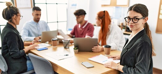Group of business workers smiling happy working at the office