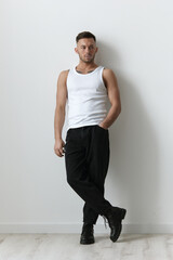 Full body shot of handsome tanned sporty attractive serious man guy posing on white studio...