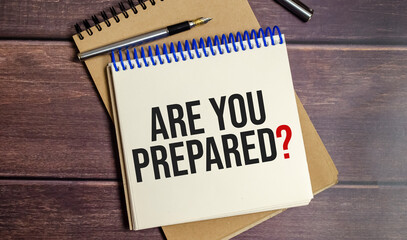 Are You Prepared Question words on notepad and wooden background