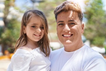 Fototapeta premium Father and daughter smiling confident standing together at park