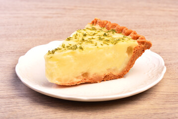 A slice of delicious lemon aloe vera pie served on table  