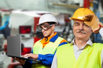 An engineering manager or mechanic worker doing routine check up in industrial factory