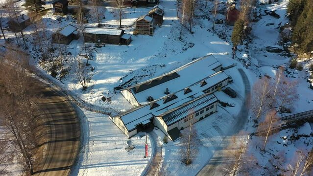 Hallingdal Folk Museum close to Rukkedalsvegen road in Nesbyen  Hallingdal Norway - Aerial approaching museum buildings during winter