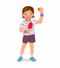 Cute little girl table tennis player holding ping pong ball with paddle ready to play