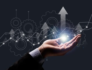 Businessman holding virtual hologram of statistics, graph and chart. Investment of growth on currency rate. Digital marketing concept.