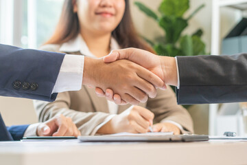 Congrats, business partnership people, asian happy young businessman handshake, shaking hands with partnership, customer or colleague after finishing successful meeting, good deal. People working.