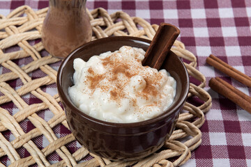 traditional sweet from the Brazilian June festivals, made of white corn with coconut and condensed milk and sprinkled with cinnamon