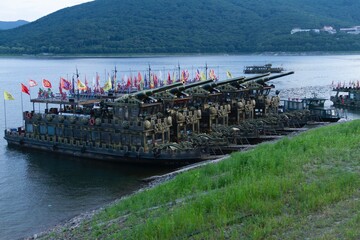 Jilin, Jilin, China - June 23 2021: Gonghua Lake and Chinese ancient war boat.