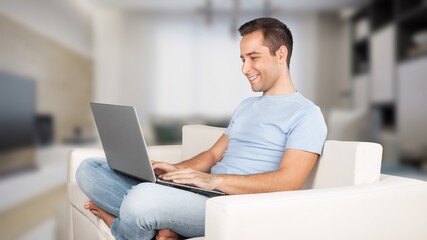 Fototapeta premium Entrepreneur of beautiful business young man working online with laptop and celebrating at home,Small Business Startup concept