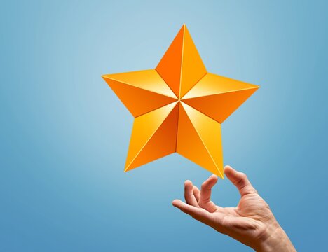 Successful and Talent Concept, Hand Raise up a Golden Star on color background
