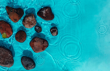 Sea stones in the sea water. Pebbles under water. Stones In Blue Water - Zen Concept