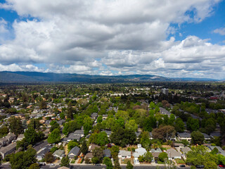 Puffy white clouds over suburbia, May 2022