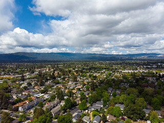 Puffy white clouds over suburbia, May 2022