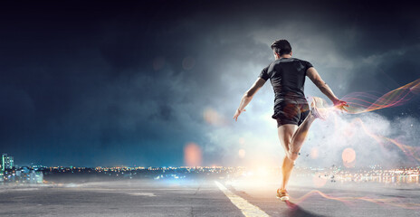 Obraz na płótnie Canvas Man in sportwear running . Mixed media