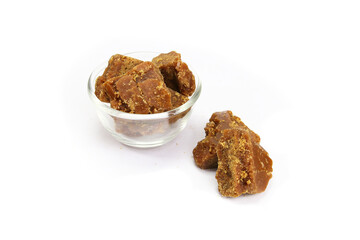 Jaggery powder and pieces isolated on white background