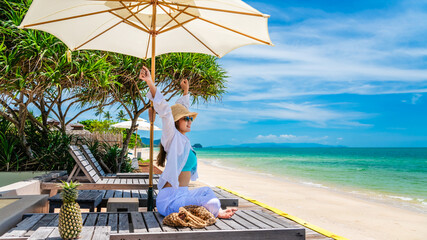 Happy traveler woman relaxing under umbrella joy fun nature view scenic landscape beach, Leisure...
