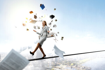 Young pretty businesswoman juggling with business items - obrazy, fototapety, plakaty