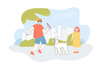 Pet owner throwing stick, playing with dog. Boy and girl training adorable puppy in city park flat vector illustration. Obedience, playground concept for banner, website design or landing web page