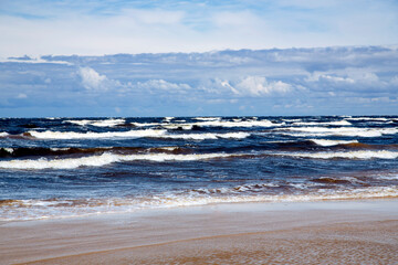 Stormy Baltic Sea with big waves in Jurmala, Latvia. Natural soft blue background.