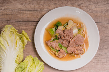 Stir Fried Cabbage with Pork in a White Plate