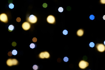 multicolored festive lights on a black background screensaver backdrop