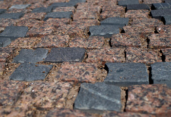 granite paving stones on the city sidewalk