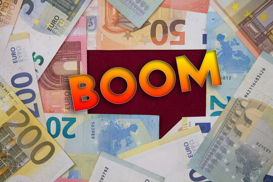 Boom word with money. Paper currency background with different banknotes.