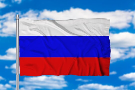Waving Russian flag against a blue sky with clouds. National flag of the Russian Federation.