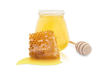 isolate jar with fresh yellow honey and nearby honey stick