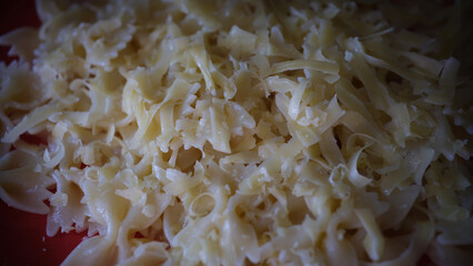 Yummy macaroni bow or farfalle pasta with grated cheese