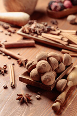 Fototapeta na wymiar Chocolate truffles on a wooden table.