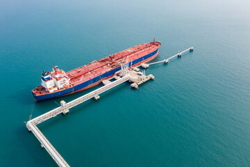 Aerial view of Modern sea harbor with transhipment equipment for oil tankers. Deck of crude oil...