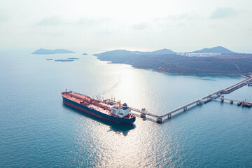Aerial view of Modern sea harbor with transhipment equipment for oil tankers. Deck of crude oil tanker with cargo pipeline. Oil tanker ship to Port of Europe - import export