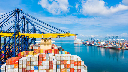 Aerial top view of container ship loading and unloading in cargo shipping port, Container cargo...