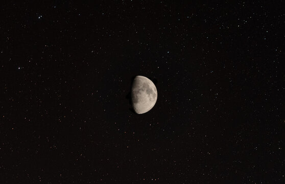 Night sky background with moon on black sky with plenty of stars. Astro photo on summer night