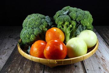 Pile of fresh and organic vegetable on the wooden basket. Famous soup ingredient in kitchen.