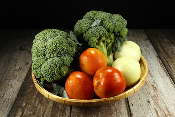 Pile of fresh and organic vegetable on the wooden basket. Famous soup ingredient in kitchen.