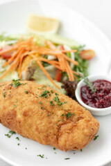 chicken cordon bleu with salad and cranberry sauce