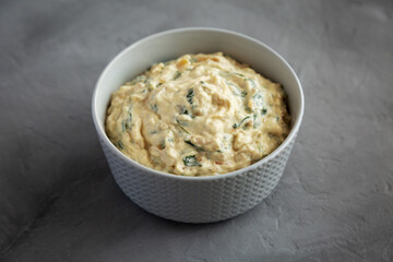 Homemade Caramelized Onion and Spinach Dip, side view.