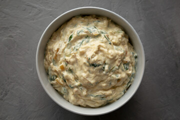 Homemade Caramelized Onion and Spinach Dip, top view. Flat lay, overhead, from above.