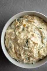 Homemade Caramelized Onion and Spinach Dip, top view. Flat lay, overhead, from above. Close-up.