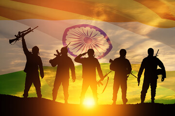 Silhouettes of soldiers on a background of India flag and the sunset or the sunrise. Greeting card for Independence day, Republic Day. India celebration.