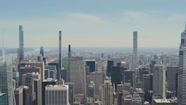 Scenic view of Manhattan with the Central Park and super-tall towers, tilt shot.
