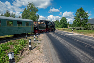 Narrow gauge train with a steam locomotive on the line Gulbene - Aluksne, Latvia.