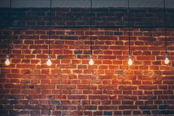 brick wall with bulb lights lamp. nice brick show room with spotlights.