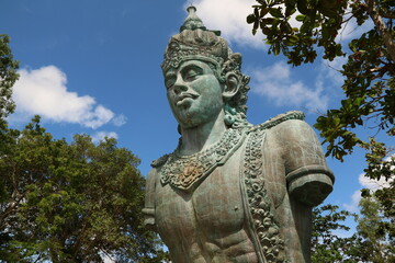 Fototapeta premium Garuda Wisnu Kencana Cultural Park (GWK). A popular place that has a statue as high as 122 meters, is called the GWK Statue. (Bali, Indonesia - June 18, 2022)