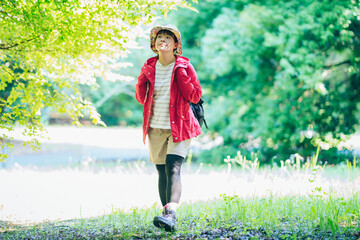 Woman walking in the fresh green mountain